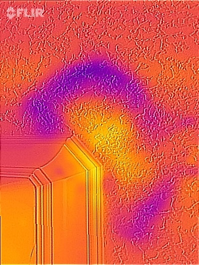 Thermal image of water damage on the ceiling in the bathroom.