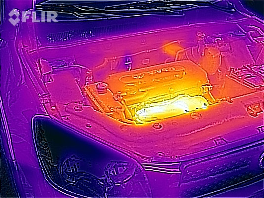 Thermal image of engine in a car in the garage.